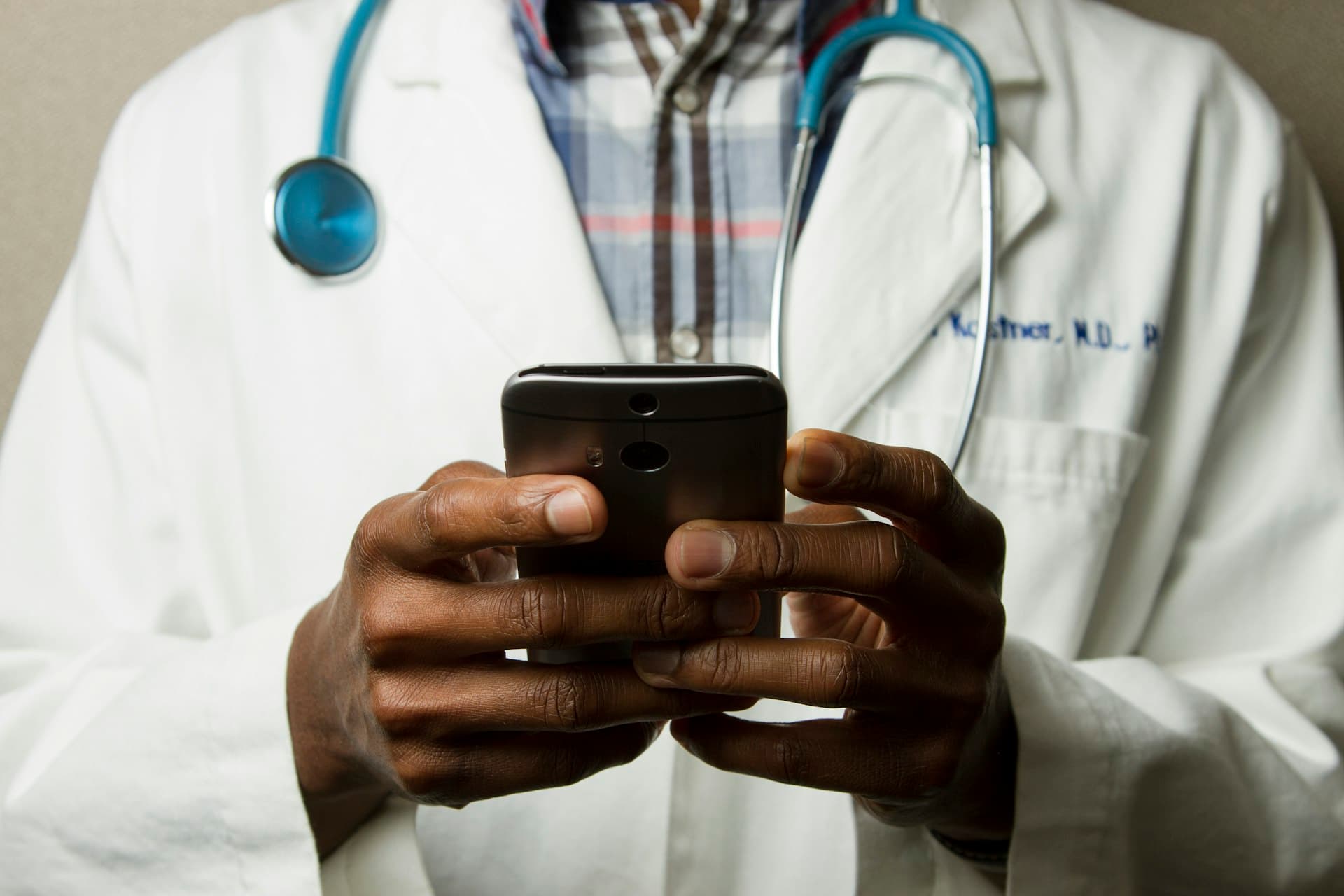Physician reviewing clinical data on a mobile device
